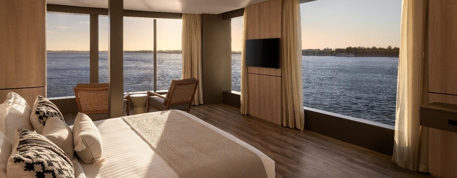 Suite with floor-to-ceiling windows onto the Nile
